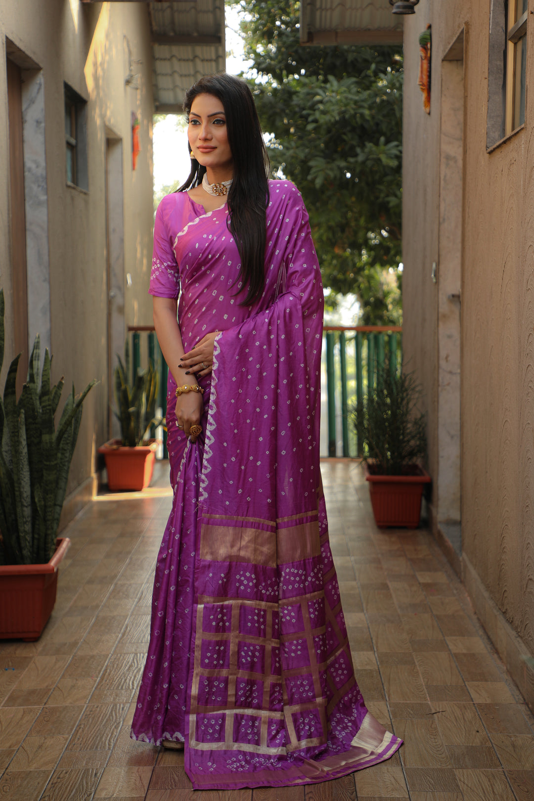 Purple Bandhej silk saree with elegant checks pattern and original craftsmanship for festive wear.