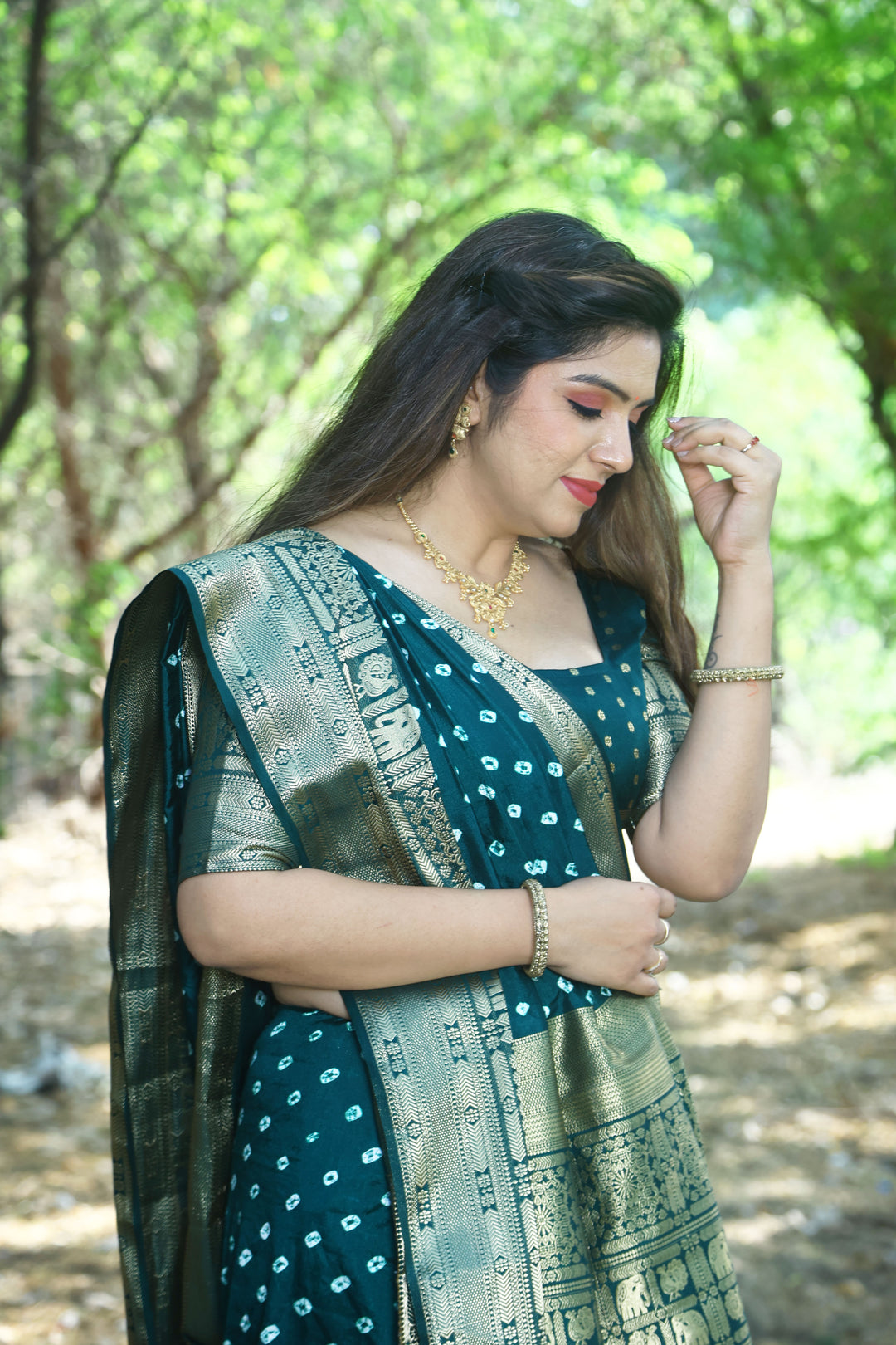 Chic black handmade Bandhej Kanjivaram silk saree with beautiful border and pallu, perfect for formal events.