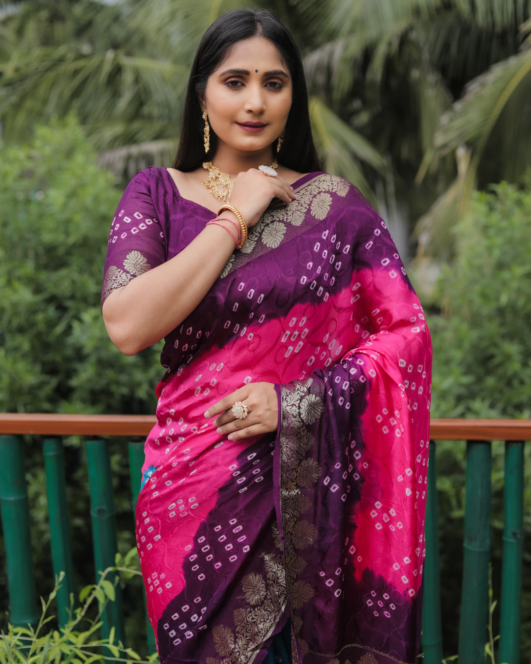 Radiant Pink Bandhej Silk Saree with intricately woven pallu and designer zari border.