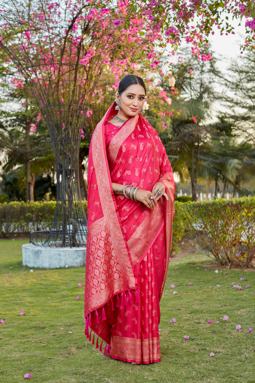 Stunning red satin silk Kanjivaram saree with intricate butta work and woven pallu, ideal for festive wear.