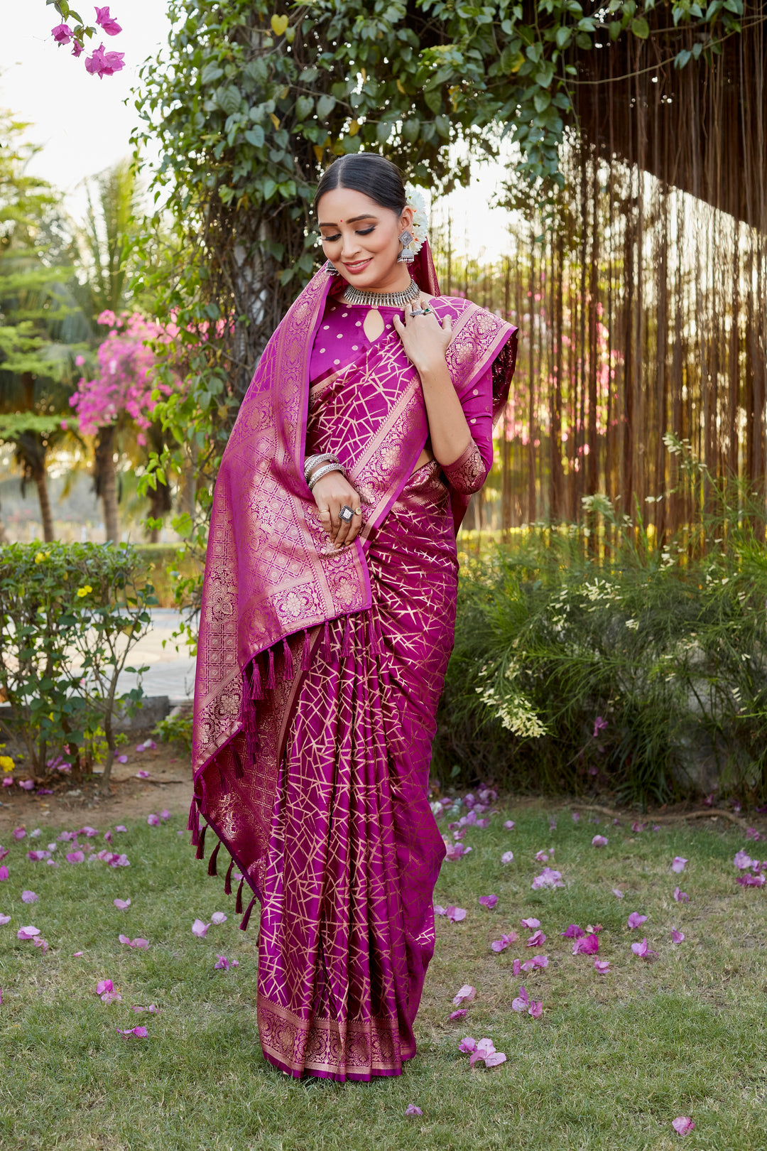 Vibrant rani-red Kanjivaram soft satin silk saree with intricate butta work, perfect for traditional occasions.