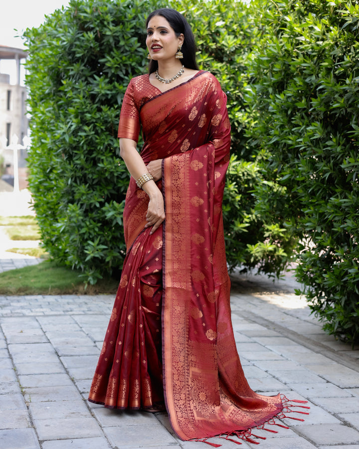 Traditional maroon soft silk saree with detailed copper weaving, paired with a contrast brocade blouse for added sophistication.