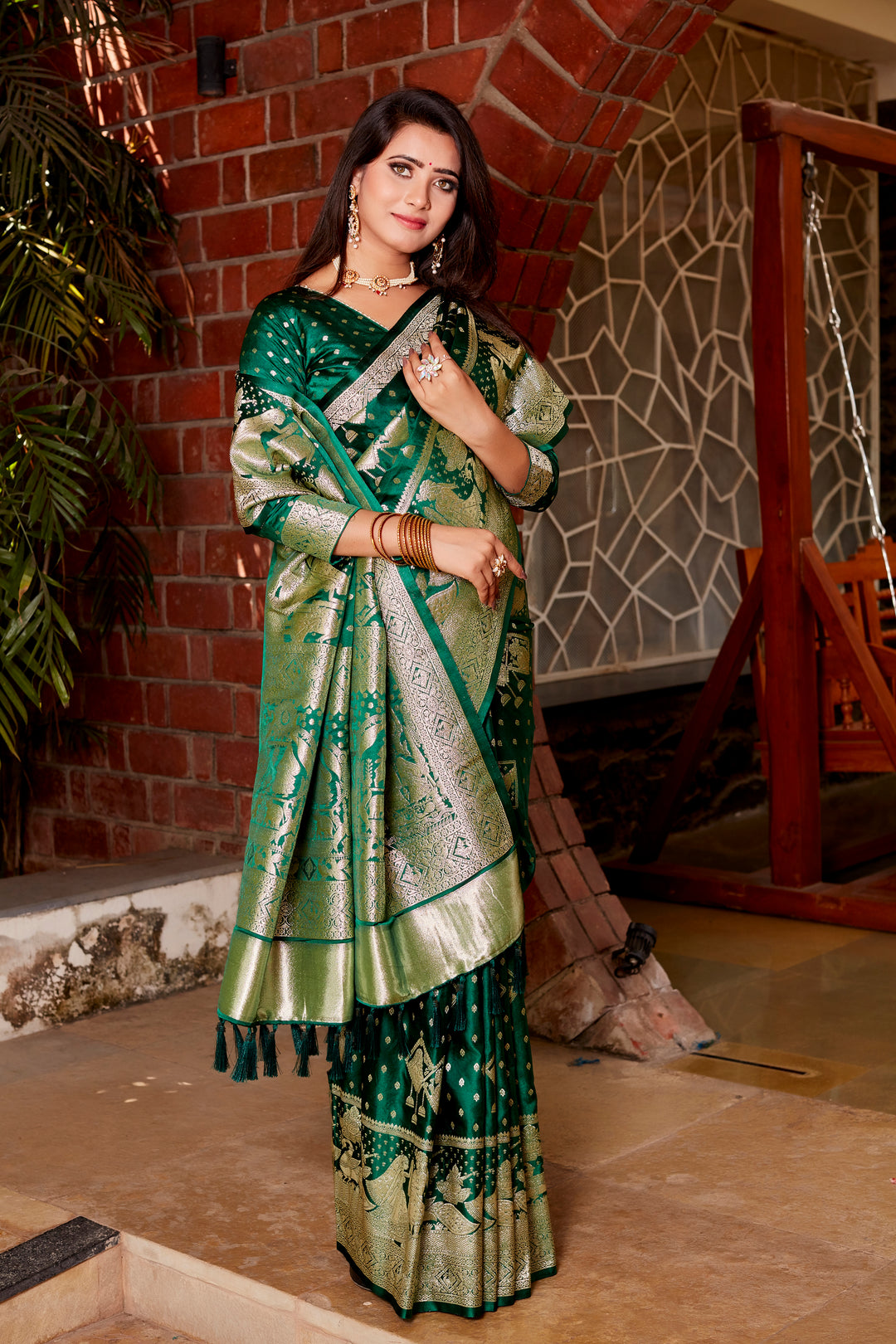 Timeless dark green saree with soft satin silk fabric, featuring a beautifully crafted pallu and designer border, ideal for festive occasions.