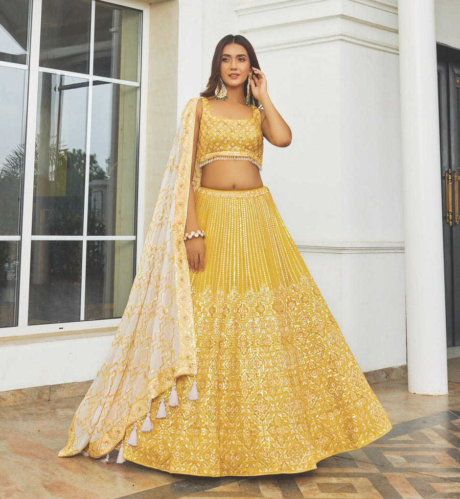 Elegant yellow georgette bridal lehenga choli, perfect for weddings with intricate detailing and a stunning traditional look.