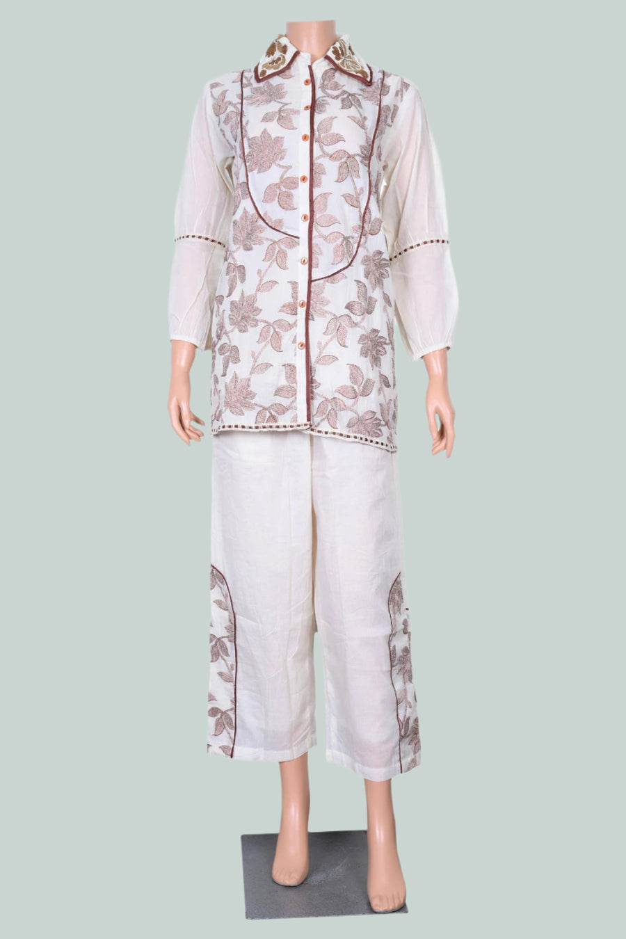 Elegant off-white kurta set made from soft mal cotton, featuring intricate thread and Moti work.