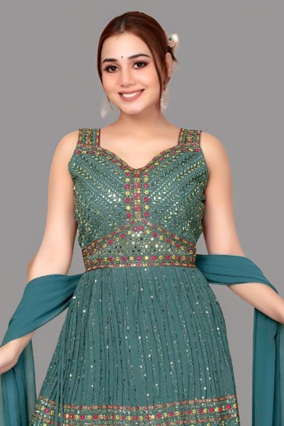 Elegant teal garara set in georgette with short kurta, perfect for weddings.