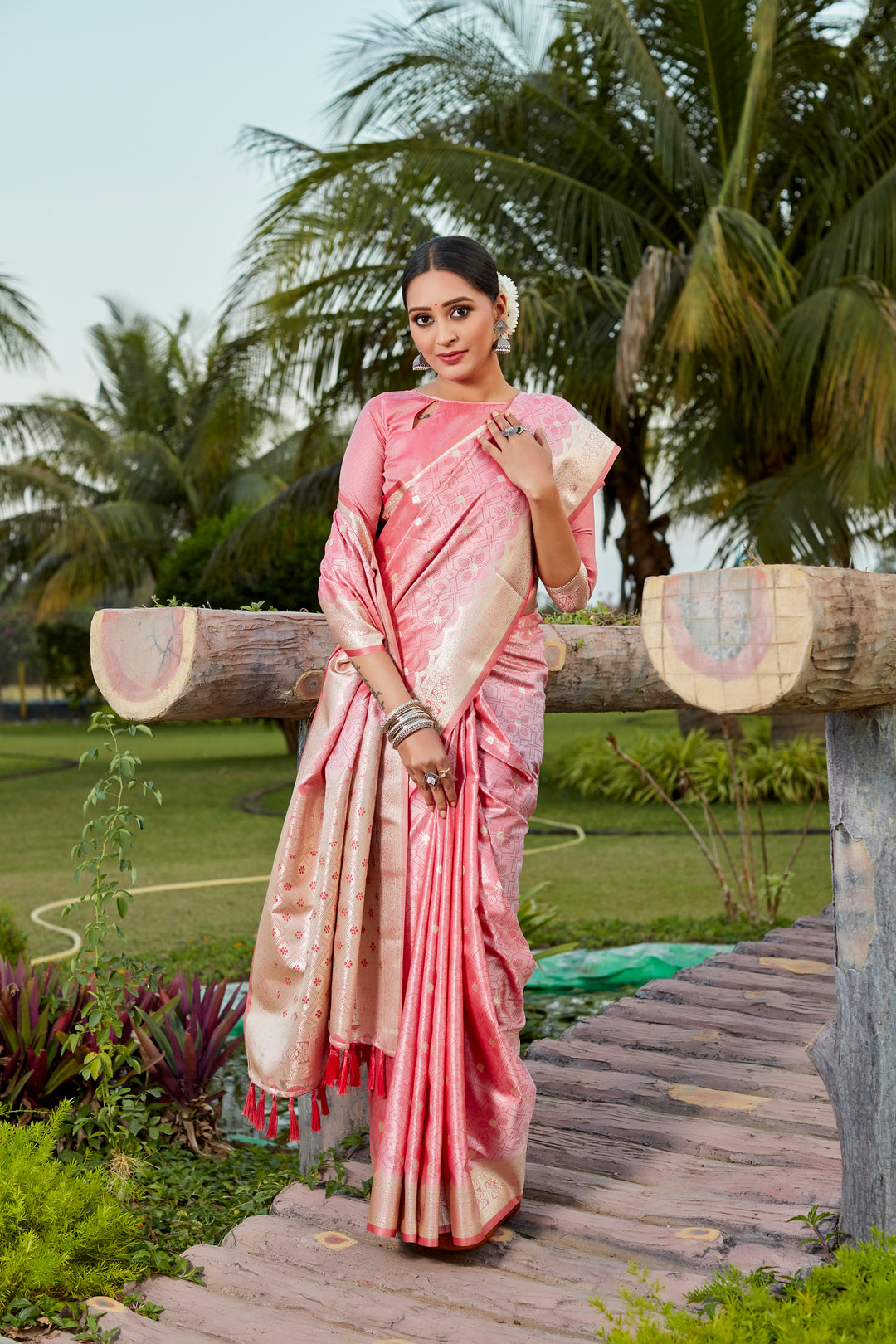 Stunning peach Kanjivaram silk saree with intricate butta work and designer border, ideal for festive celebrations.