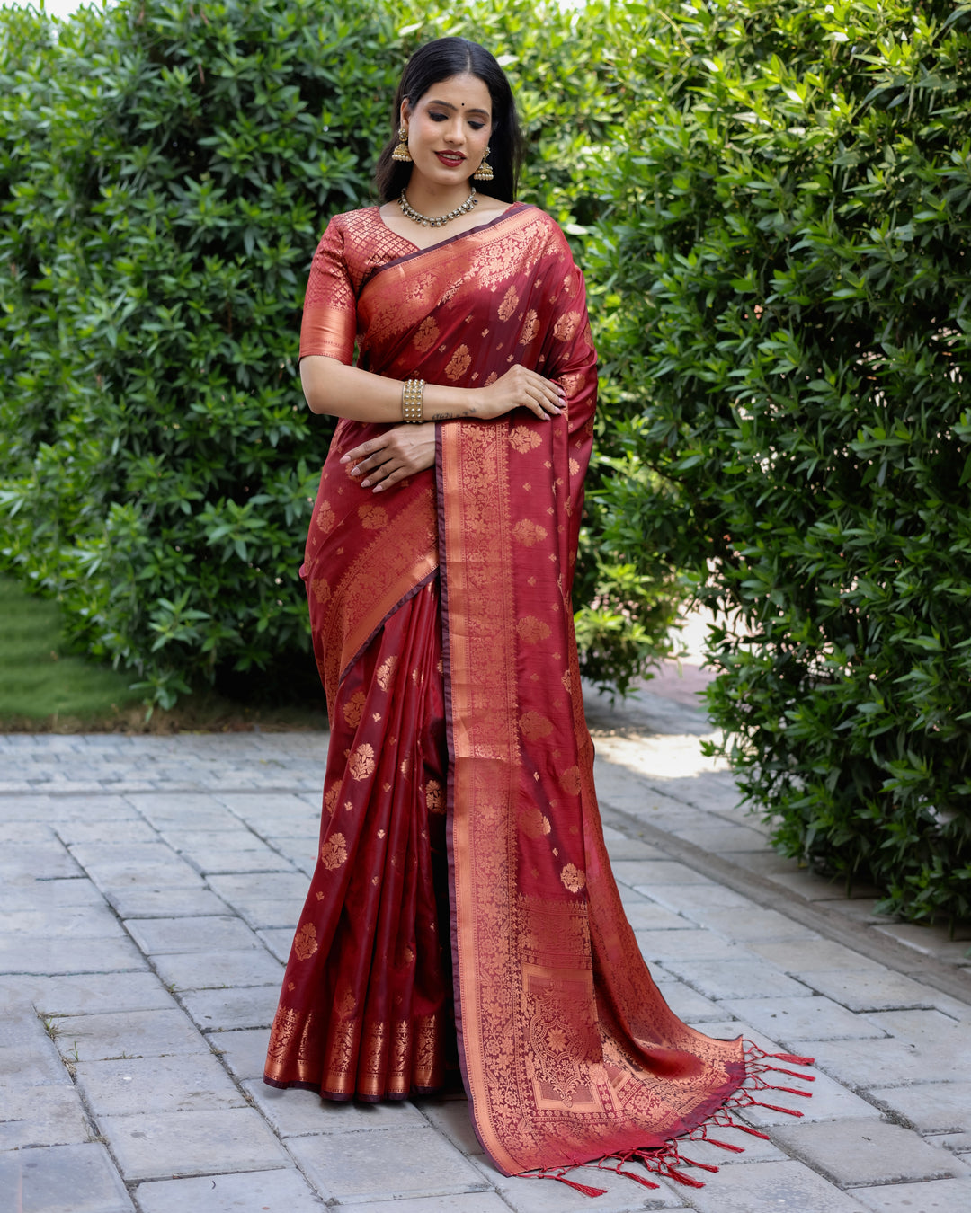 Maroon soft silk saree with exquisite copper weaving and contrasting border, ideal for festive events.