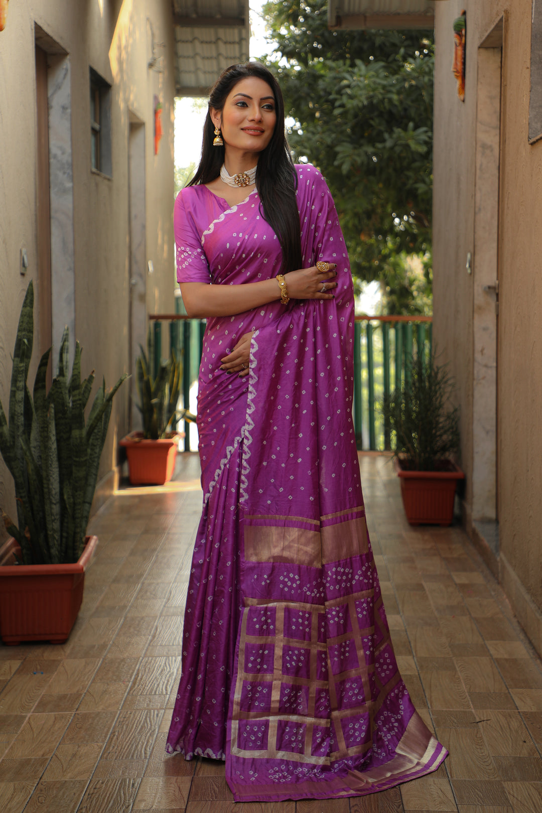 Timeless purple Bandhej silk saree with checks design and original craftsmanship.