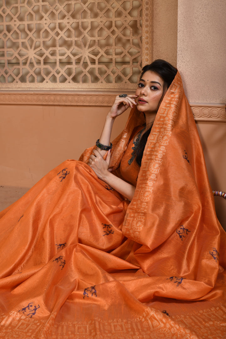 Vibrant orange Banglori handloom raw silk saree with rich pallu weaving, ideal for festive occasions.