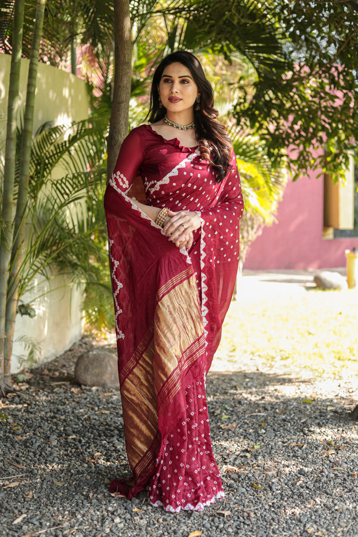 Maroon Bandhej Silk Saree with stunning Zari weaving and Pallu for weddings and festive occasions.