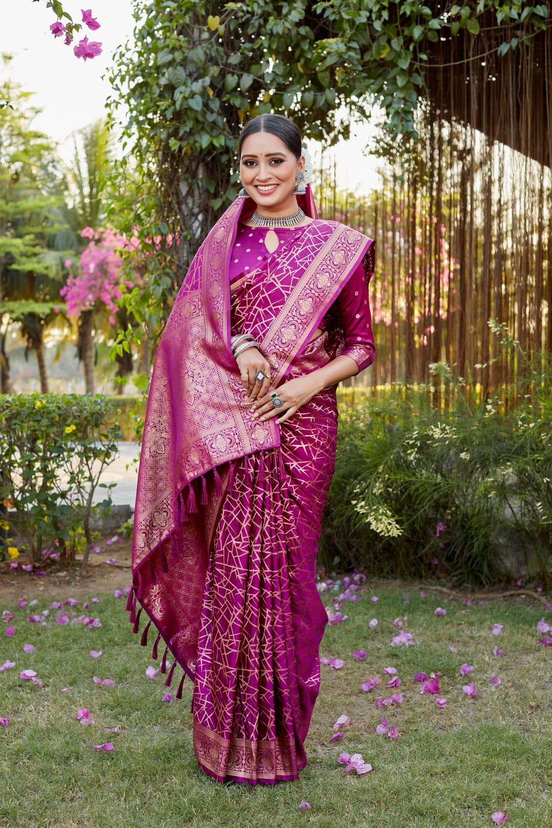 Rich rani-red Kanjivaram soft satin silk saree with detailed butta design, ideal for weddings and festive wear.