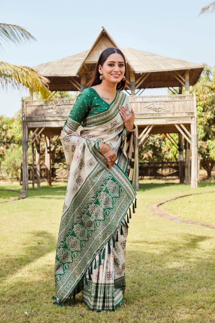 Traditional green Kanjivaram soft silk saree with intricate work and beautiful designer borders.