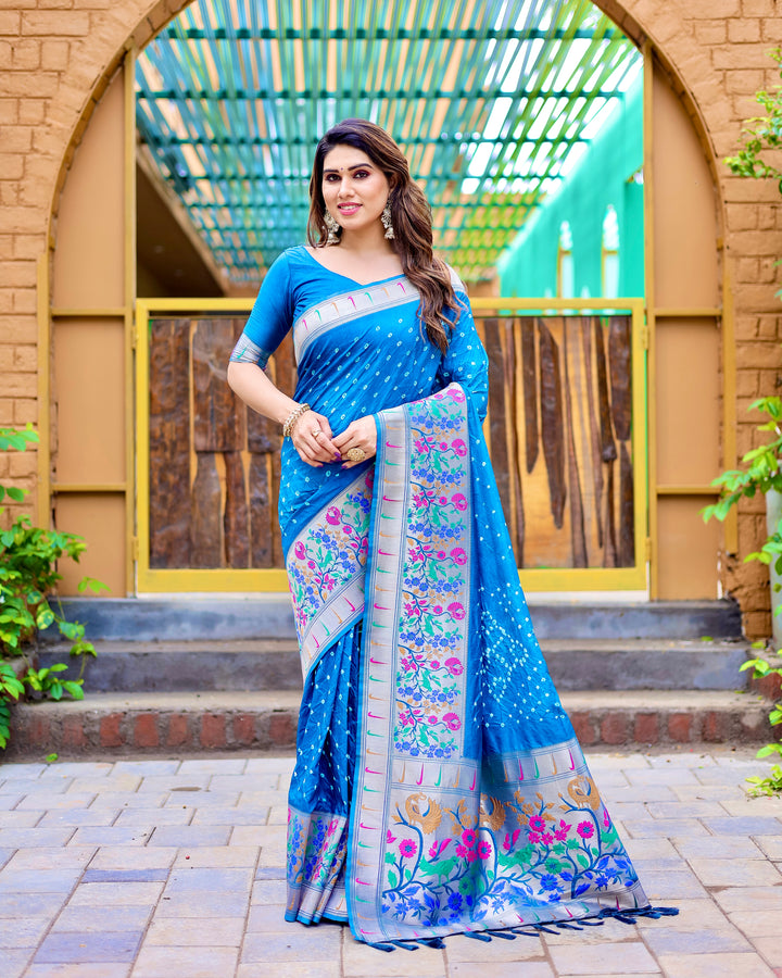 Blue Paithani Bandhej silk saree with zari weaving and matching tassels, designed for festive and grand occasions.