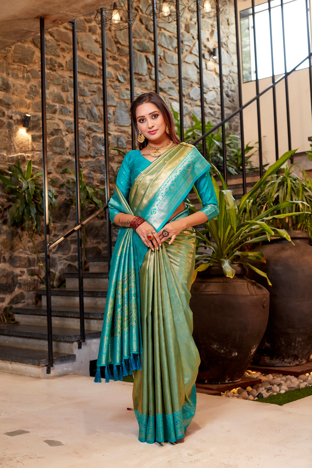 Elegant light-green Tissue silk saree with stunning contrast border and fine weaving.