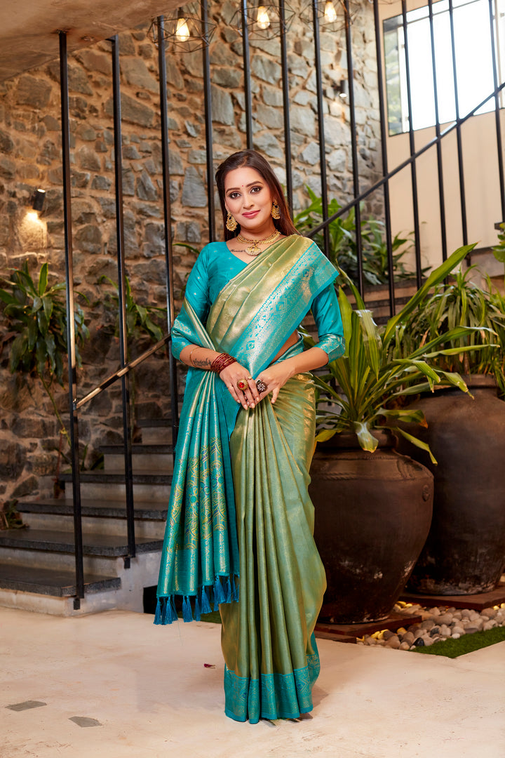 Timeless light-green Tissue silk saree with beautiful contrast border and delicate weaving.