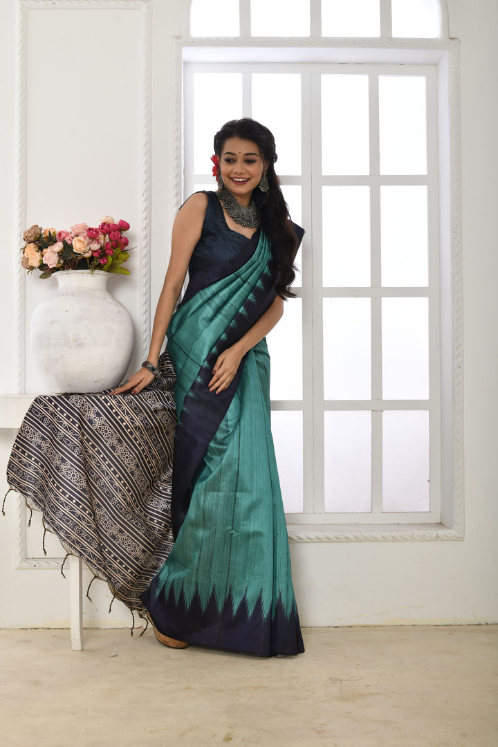 Tussar silk saree with printed temple border and fabric pattern, ideal for special occasions and events.