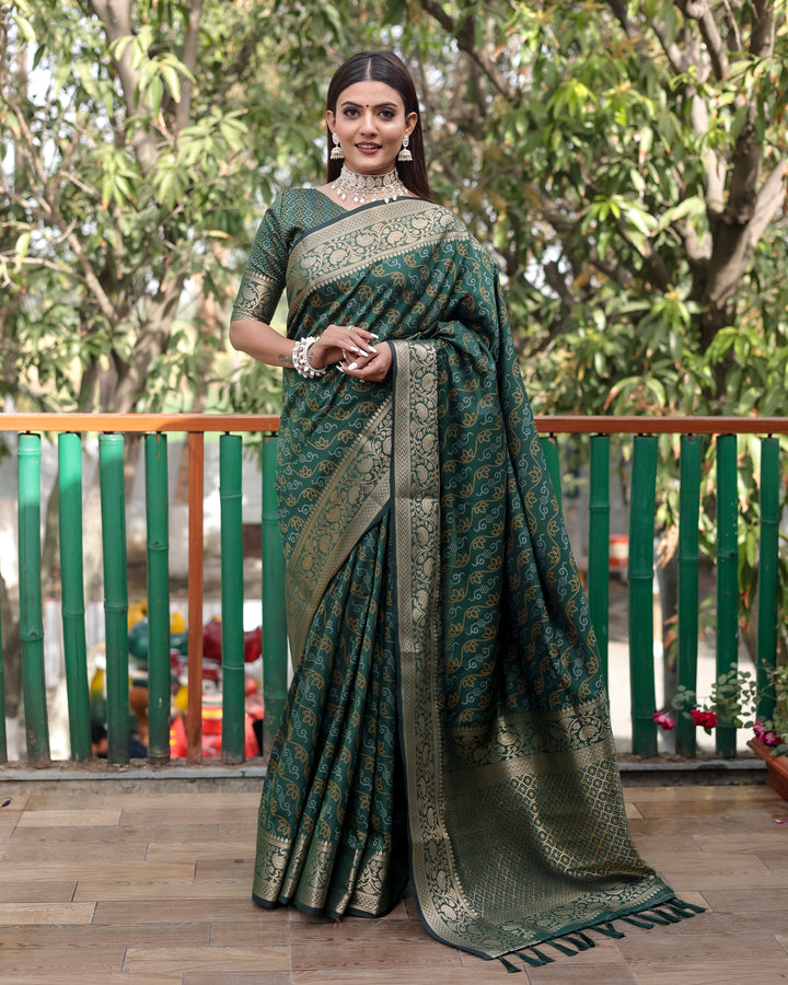 Traditional green Bandhej Patola silk saree with delicate zari work and Kanchi borders, perfect for grand celebrations.