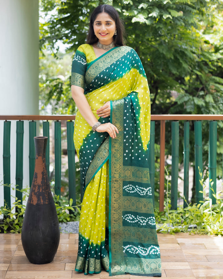 Gorgeous green Bandhej silk saree with intricate zari work and matching blouse, perfect for weddings and bridal wear.