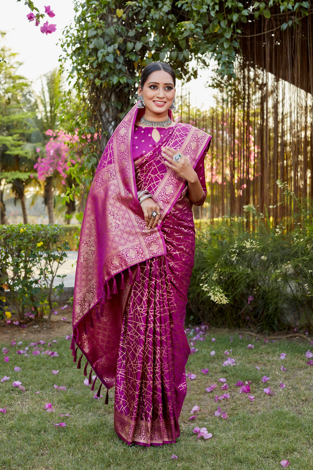 Gorgeous rani-red Kanjivaram soft satin silk saree with intricate butta work, perfect for bridal and formal wear.