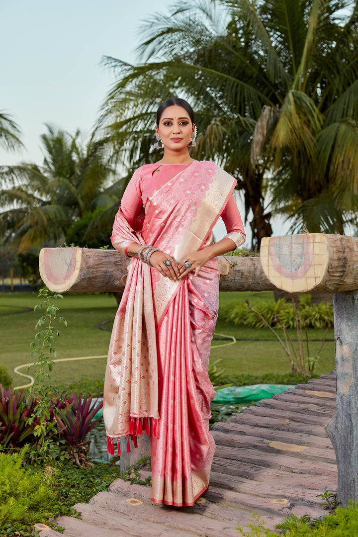 Gorgeous peach Kanjivaram silk saree with intricate butta work and designer border, perfect for luxurious weddings.