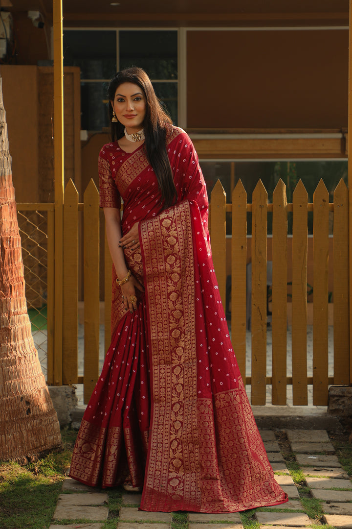 Luxurious red Bandhej Kanjivaram silk saree with intricate zari weaving and a richly woven pallu, perfect for weddings and celebrations.