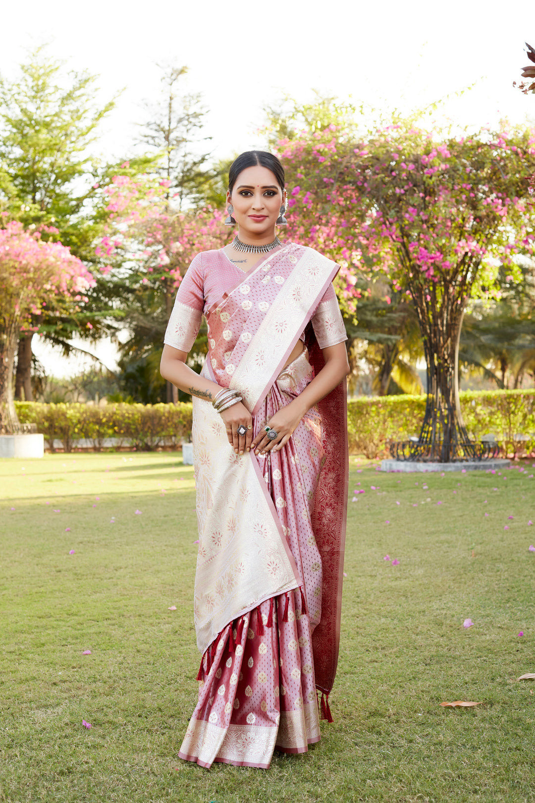 Beautiful pink Kanjivaram Soft Satin Silk saree, with a shimmer finish, intricate butta work, and a rich satin border.