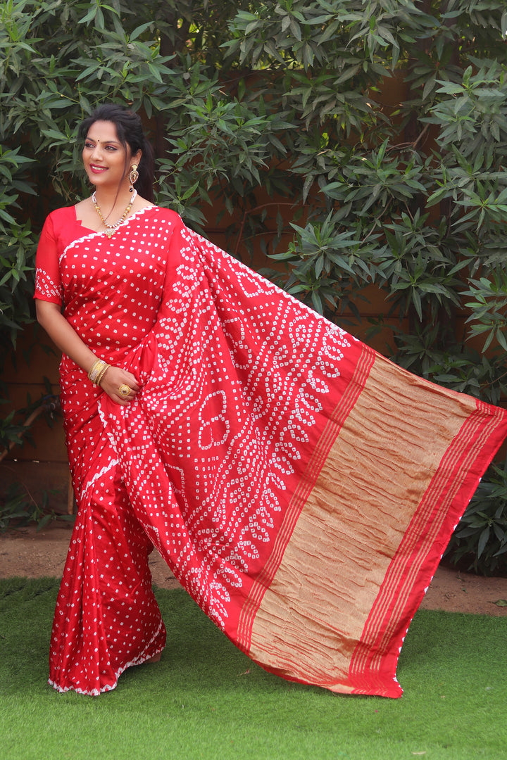 Classic red pure Bandhej silk saree with rich Zari pallu, perfect for celebrations in the USA.