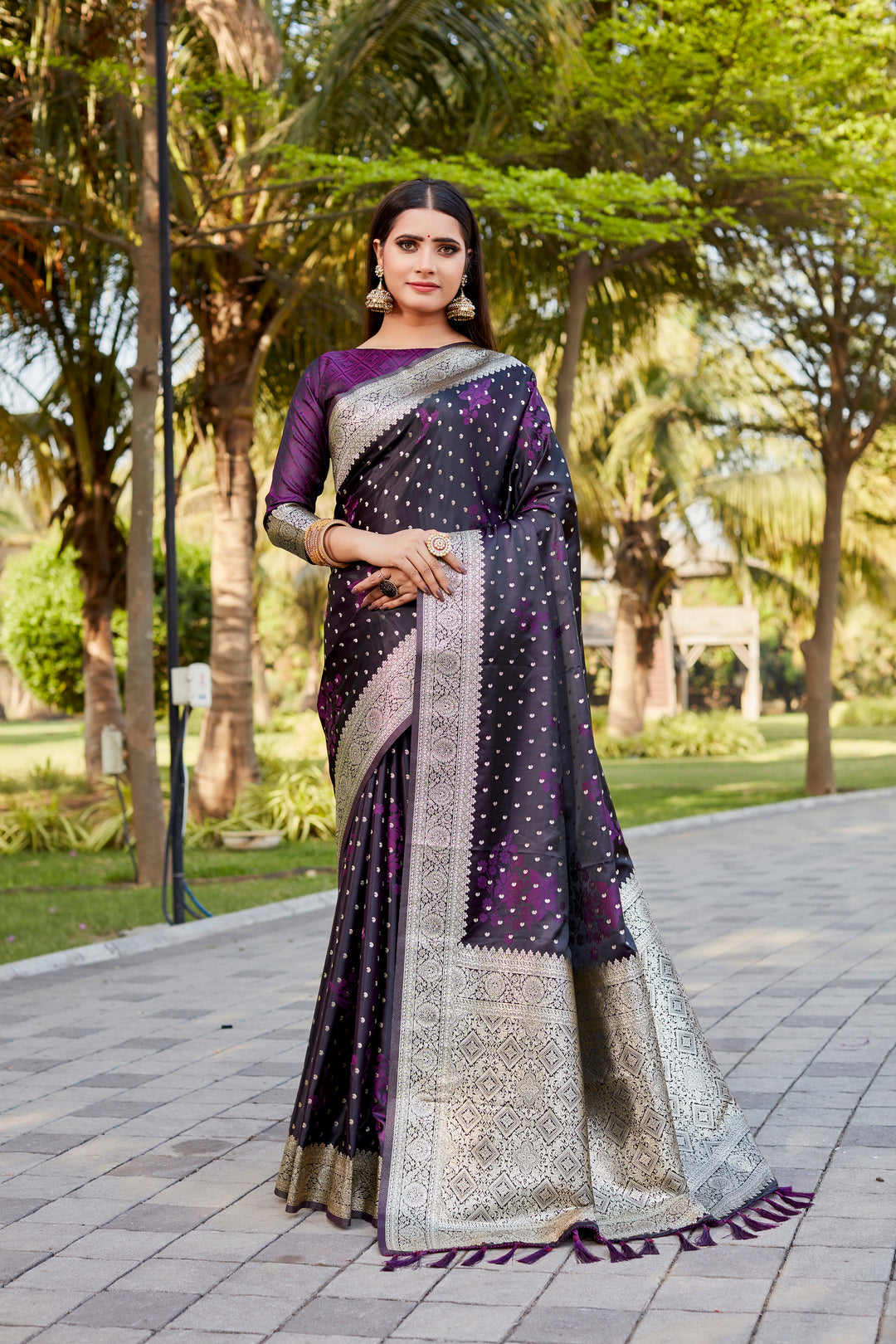 Dark-purple Soft Satin Kanjivaram saree with intricate butta work and elegant shimmer.