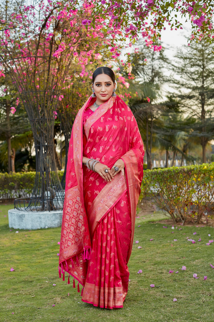 Chic red Kanjivaram saree with intricate butta work and woven pallu, ideal for traditional events and weddings.