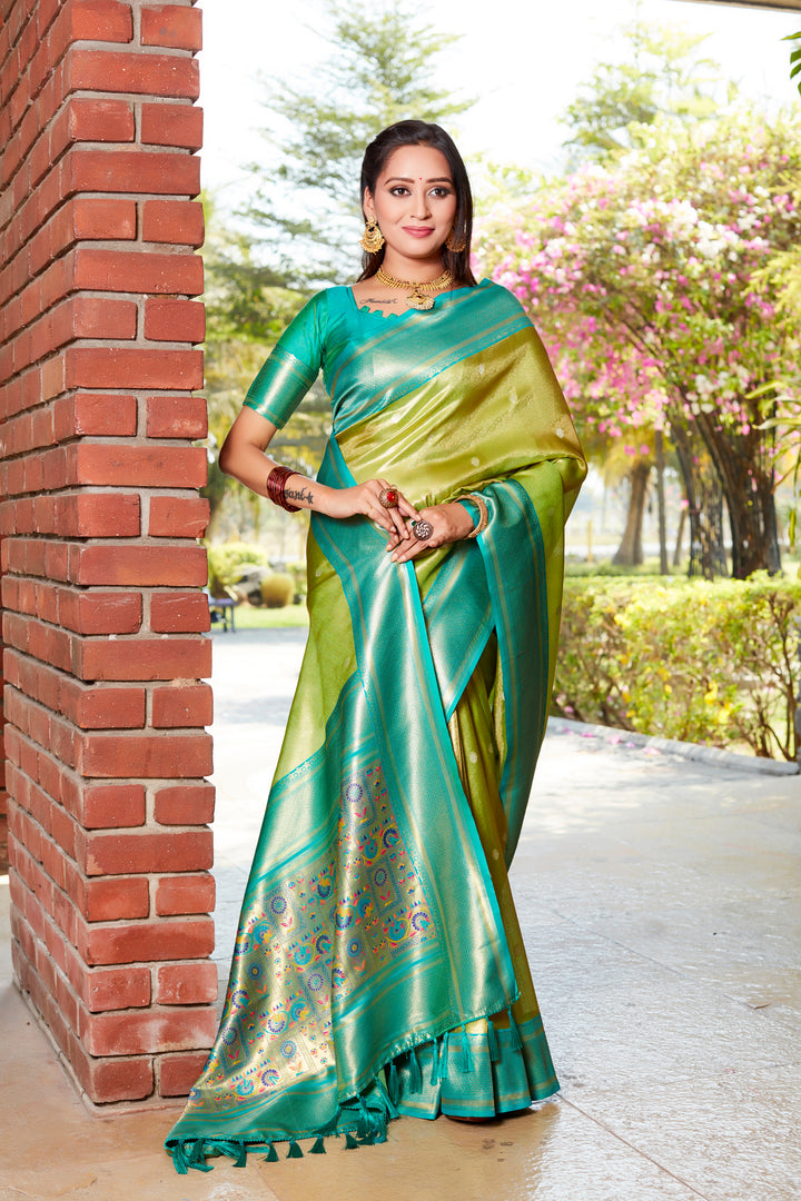 Beautiful parrot-green tissue silk saree with rich pallu and contrast blouse, perfect for weddings and celebrations.