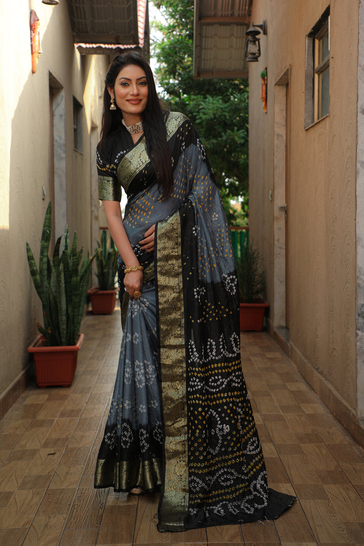 Stylish grey Bandhej Tapeta saree, showcasing traditional elegance with a modern twist.