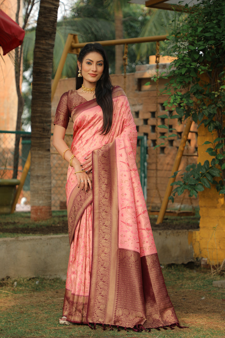 Gorgeous pink Kanjivaram saree, designed with rich textures and perfect for Indian wedding ceremonies.