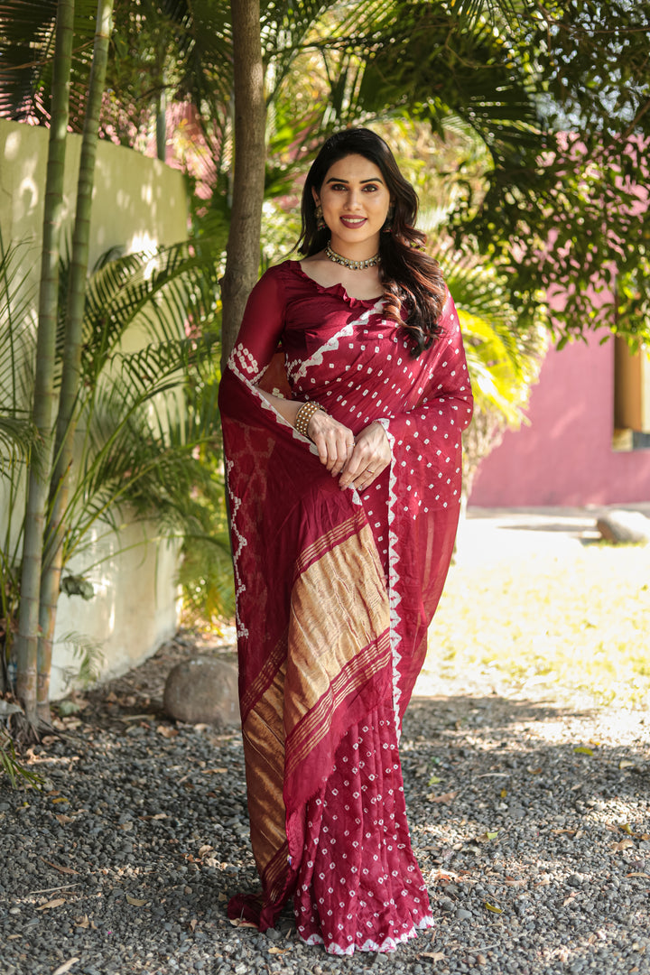 Traditional Maroon Bandhej Silk Saree with original design and exquisite Zari weaving for grand events.