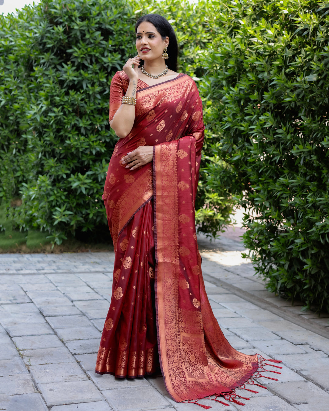 Beautiful maroon soft silk saree featuring copper work and intricate weaving, perfect for cultural celebrations.