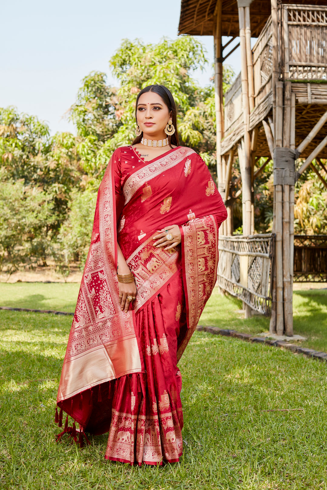 Elegant red satin Kanjivaram saree with intricate elephant border details, perfect for weddings and cultural celebrations.