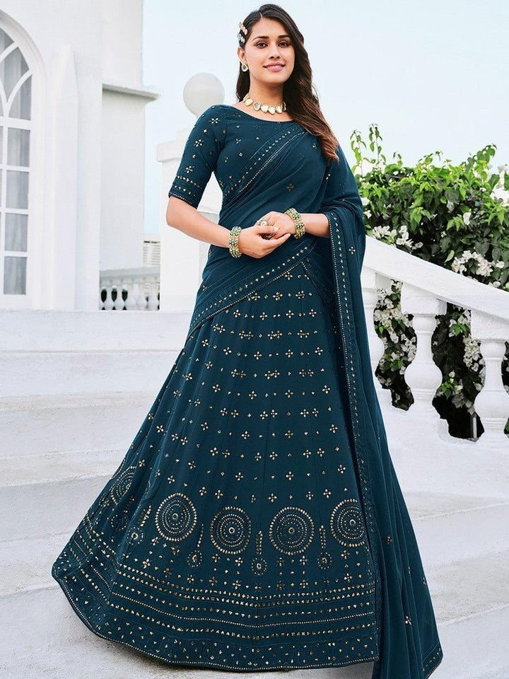 Teal blue lehenga choli for women with thread and sequins embroidery.