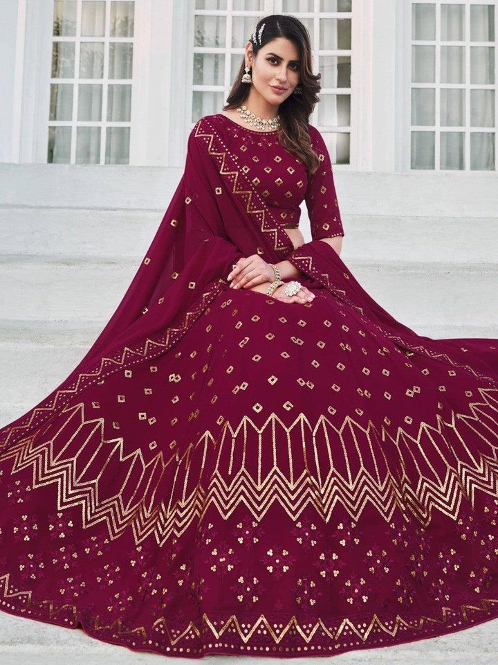 Semi-stitched deep pink lehenga with fully unstitched blouse material.