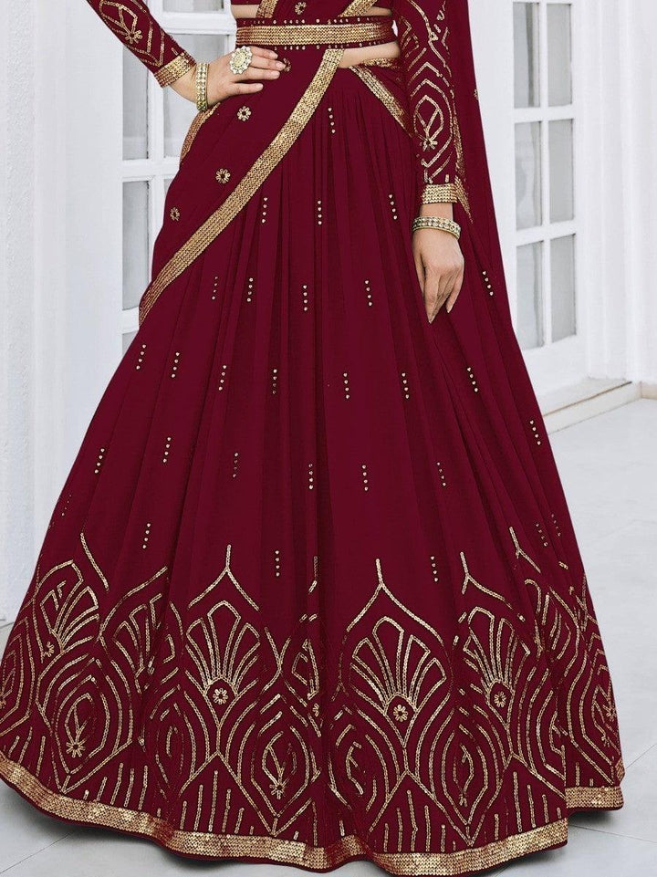 Bridal and party wear lehenga in maroon with beautiful embellishments.