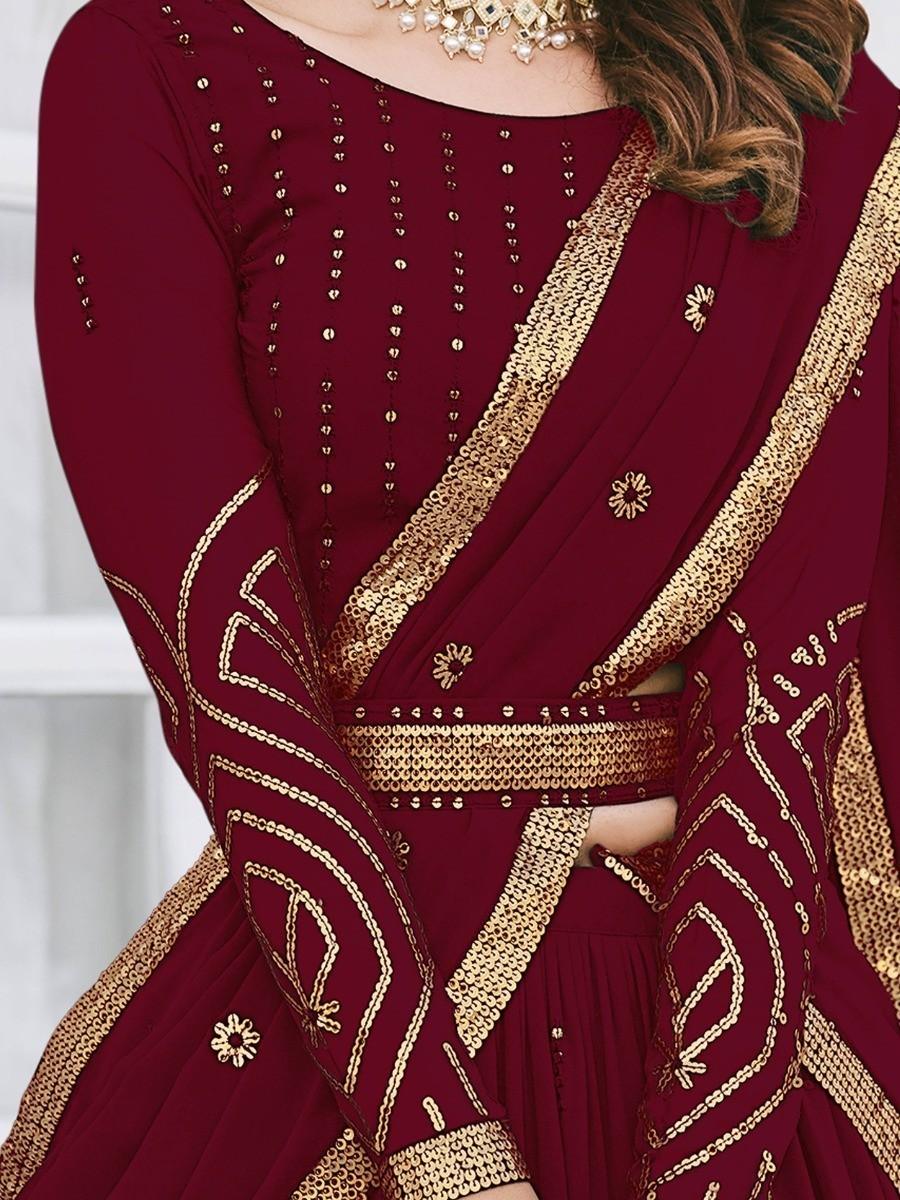 Elegant maroon lehenga with detailed thread and sequin embroidery.