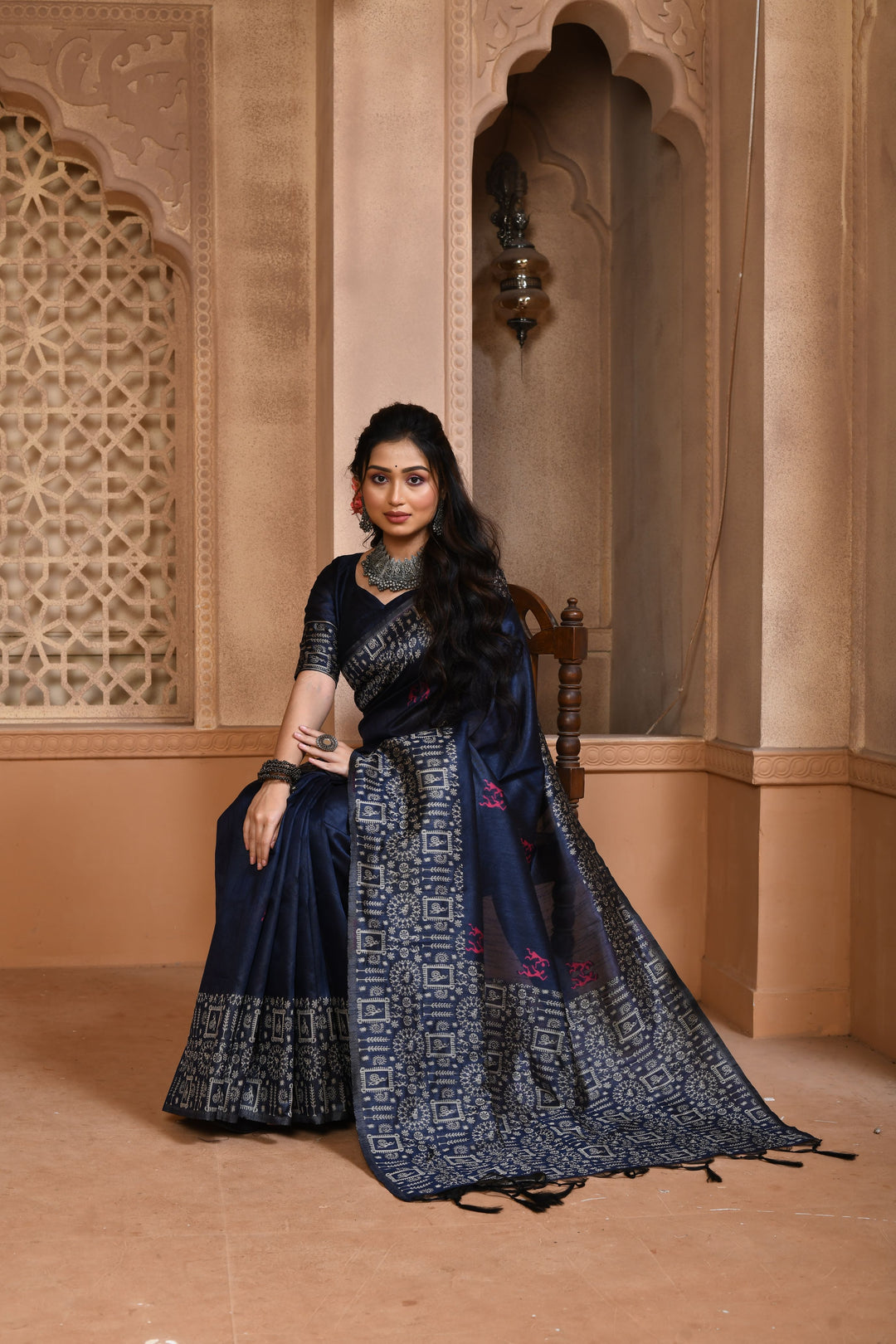 Beautiful orange Banglori raw silk saree with detailed pallu weaving, ideal for traditional gatherings.