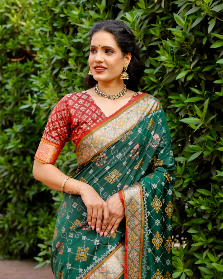 This green Ikkat Patola silk saree is a perfect blend of traditional artistry and modern elegance, with stunning Zari borders and pallu.