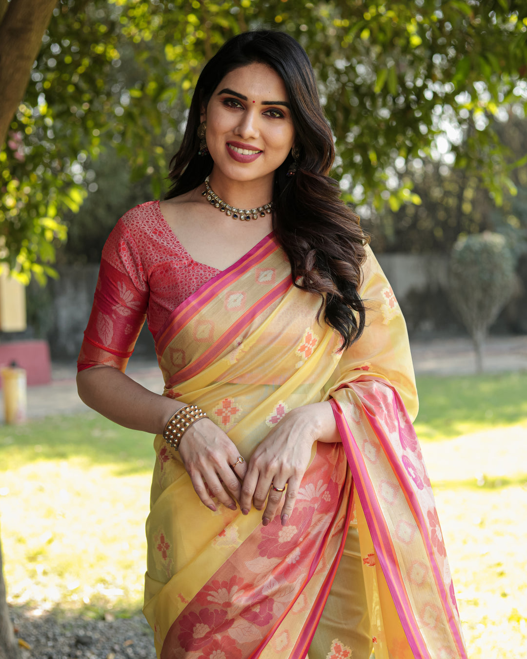 Elegant yellow Organza saree with intricate Ikkat weaving, offering timeless appeal and effortless beauty.