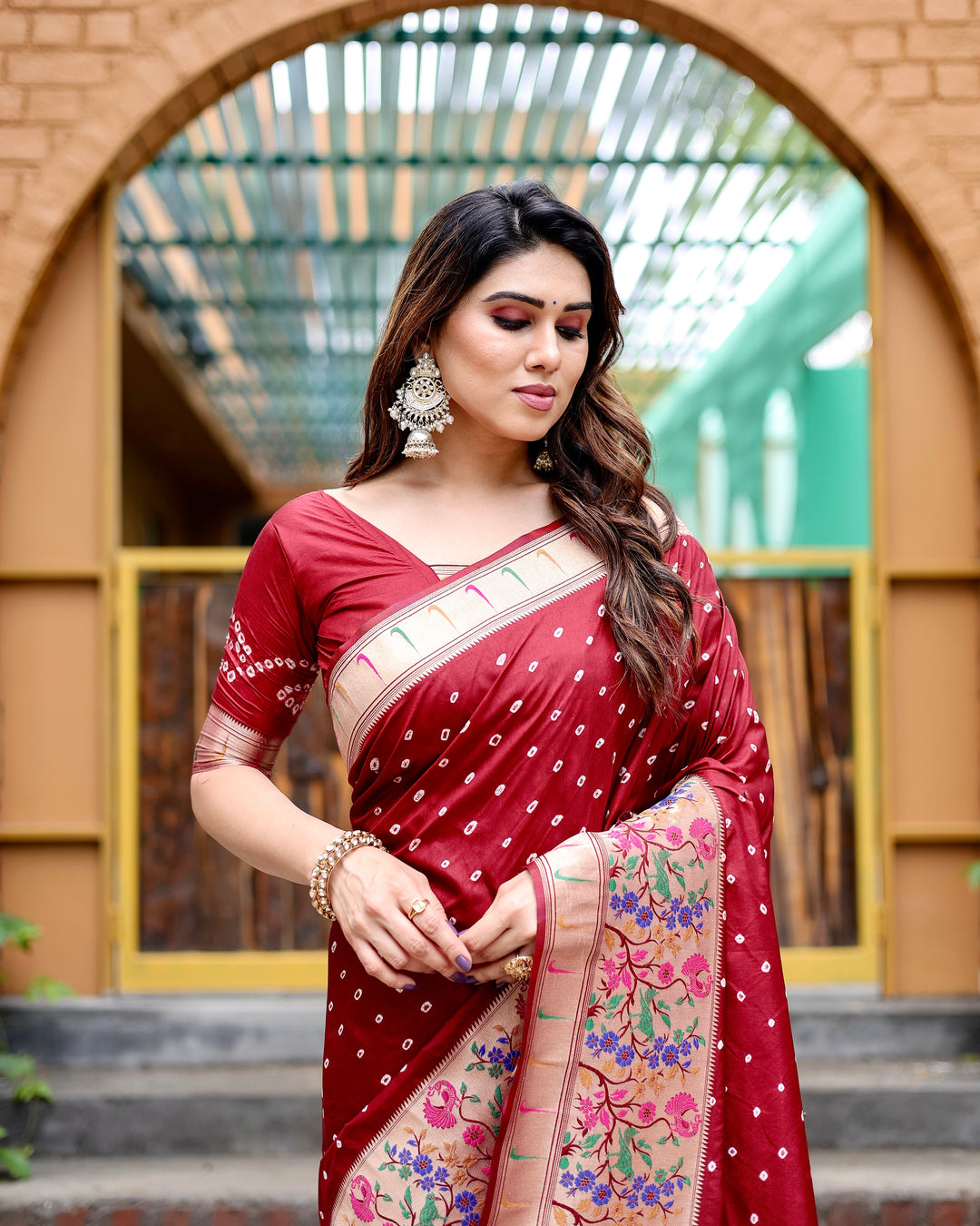 Maroon Bandhej Paithani silk saree with intricate zari weaving and Paithani border, perfect for a stunning bridal look.