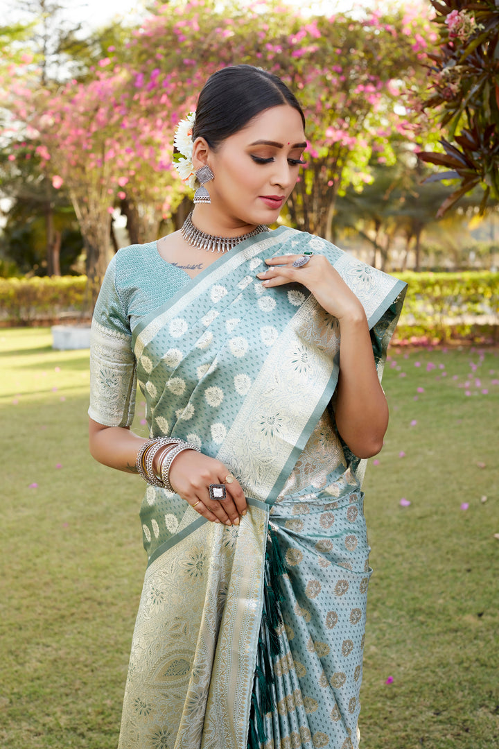 Beautiful sky blue Kanjivaram Soft Satin Silk saree, perfect for festive occasions with its intricate butta work and satin border.