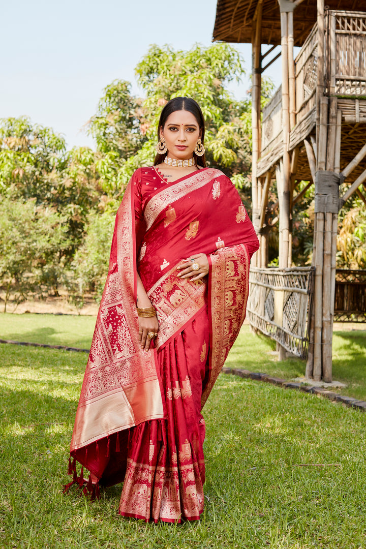 Beautiful red satin Kanjivaram saree with a vibrant elephant border, perfect for festive occasions and traditional gatherings.