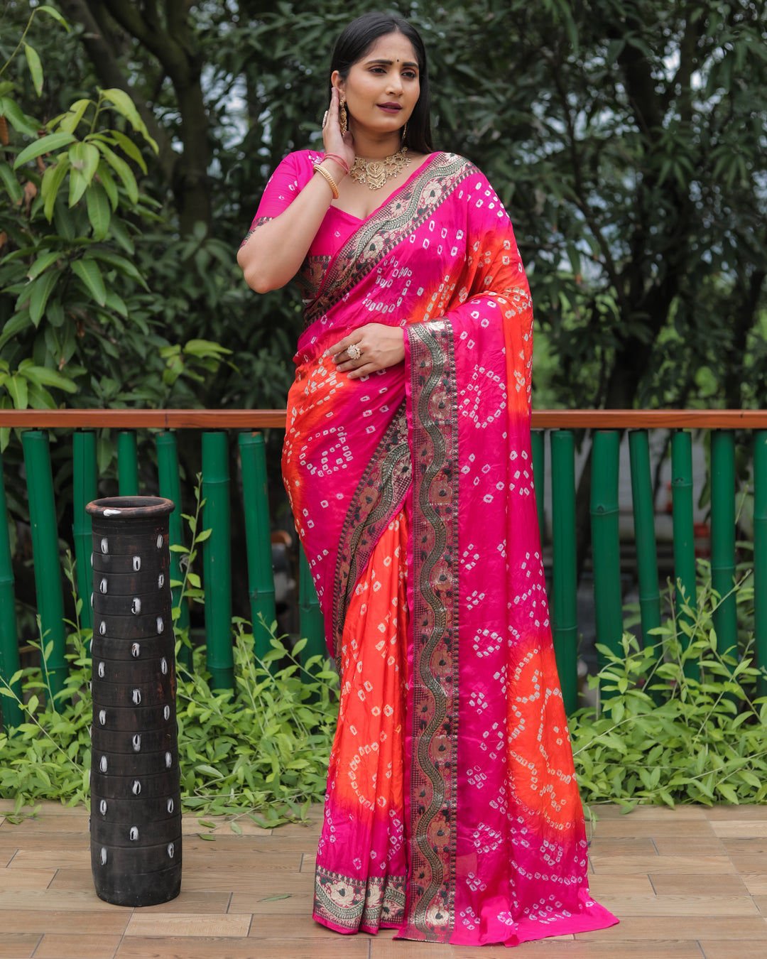 Orange Bandhej Tapeta silk saree with bold dual-color design and traditional Bandhej pattern.