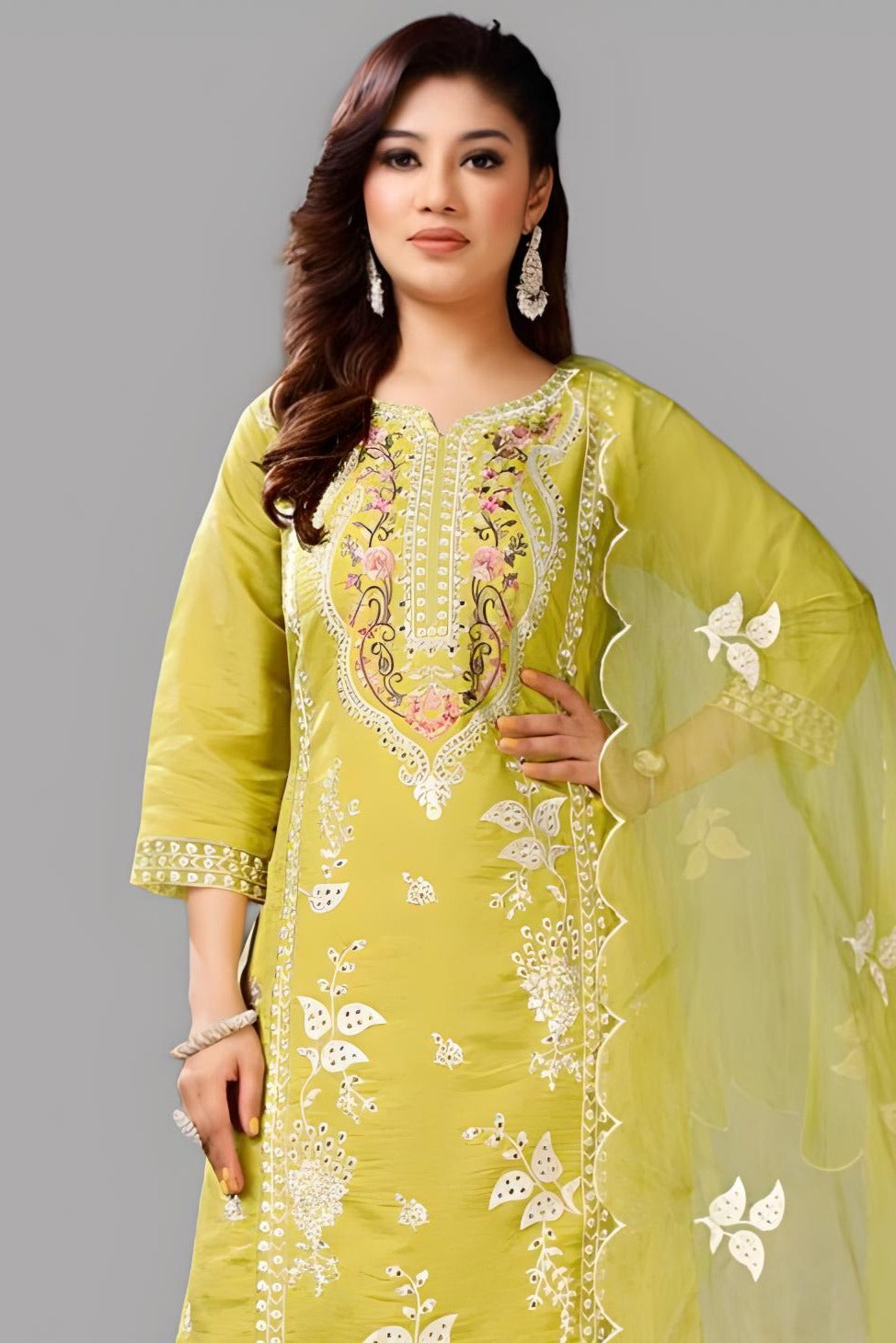 Stylish yellow kurti and pant set made from luxurious Roman silk, ideal for casual outings.