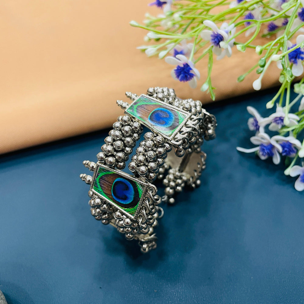 Vintage oxidised bracelet adorned with colorful stones, adding charm to your outfit.