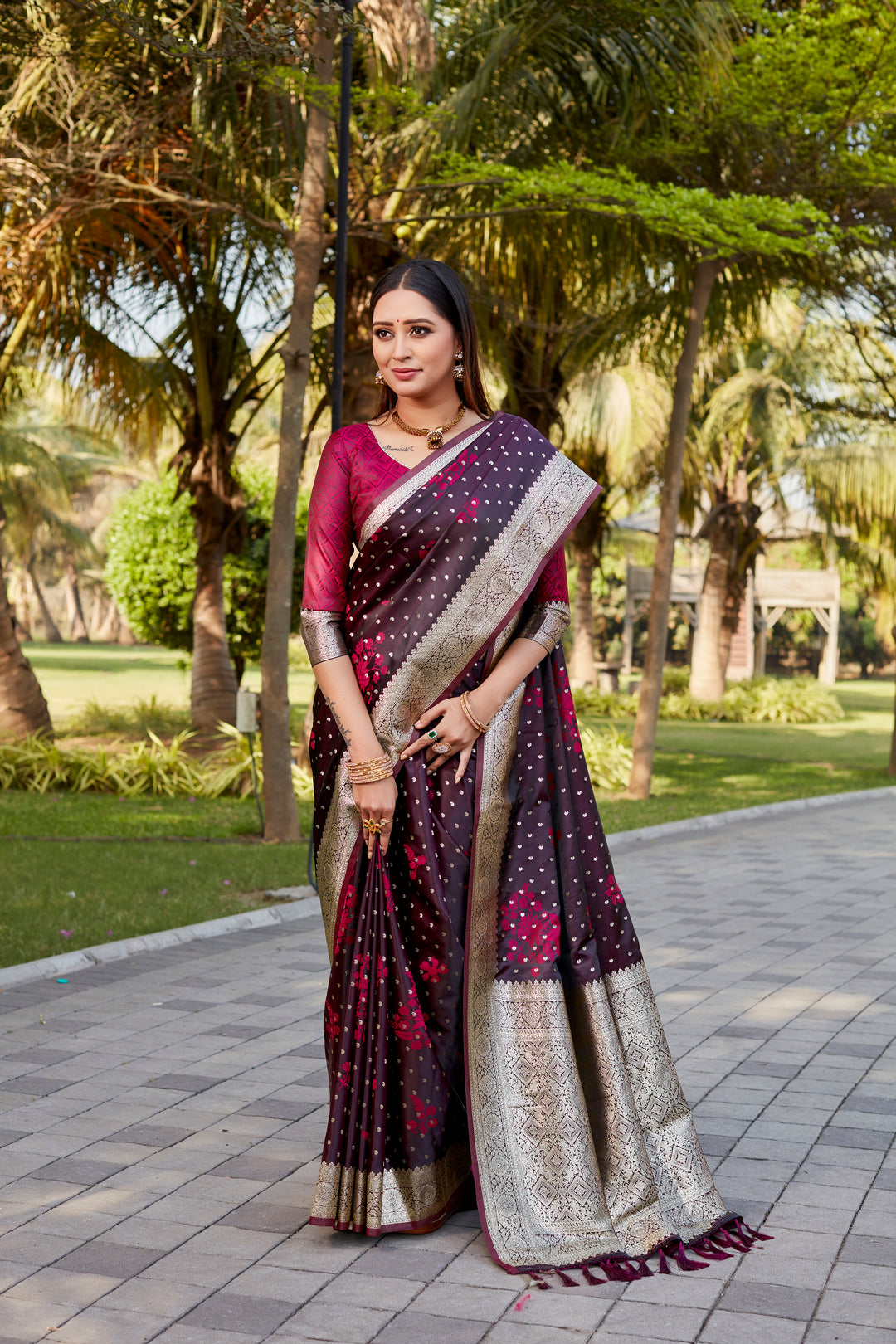 Wine Soft Satin Kanjivaram saree with intricate butta work and shimmering finish.